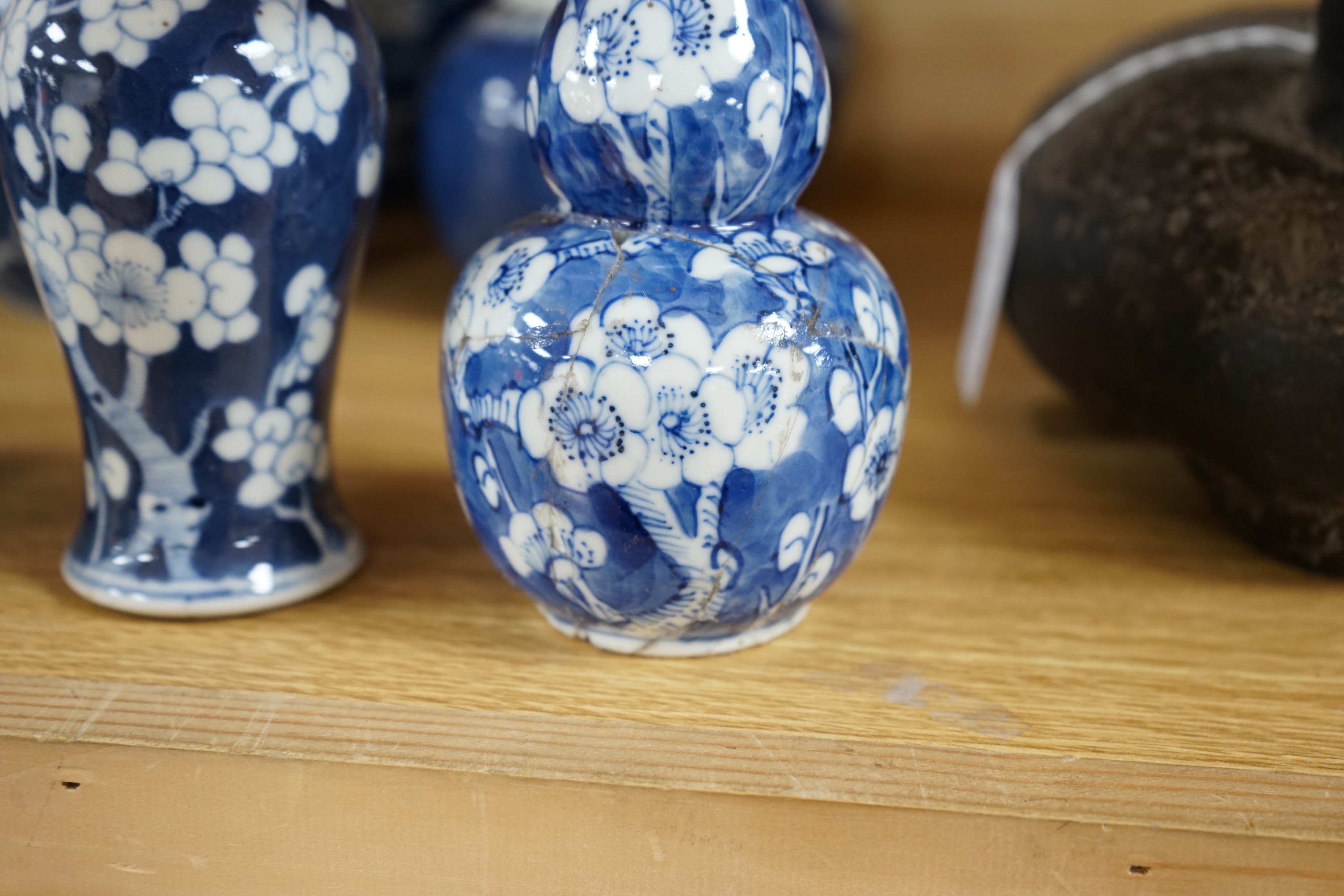 Four Chinese blue and white prunus pattern ginger jars, together with three similar vases. 19th/early 20th century, Tallest 15cm